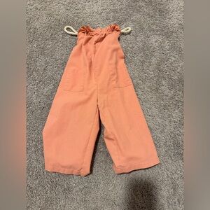 Jumpsuit ropes that cross